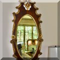 DM01. Mahogany and gilt mirror with cherub decoration. 